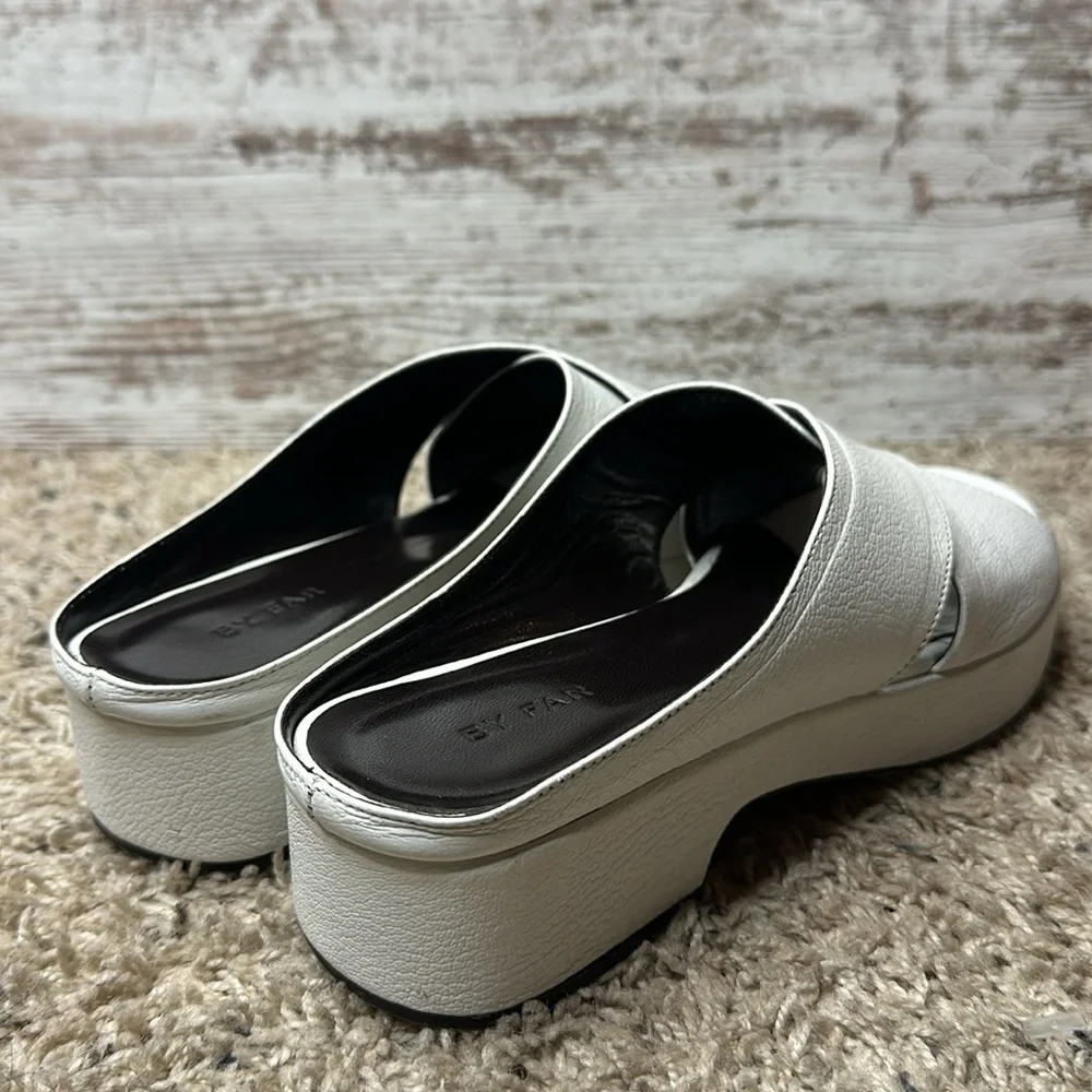 By Far Iggy Mules cross-front platform sandals in white leather